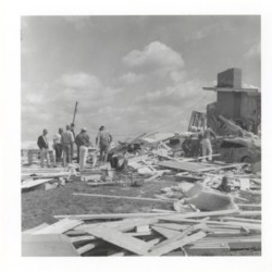Workers Assessing the Damage