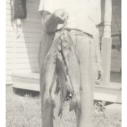 unknown man with fish.jpg