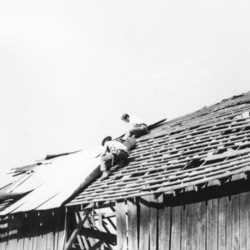 Repairing roof on old barn